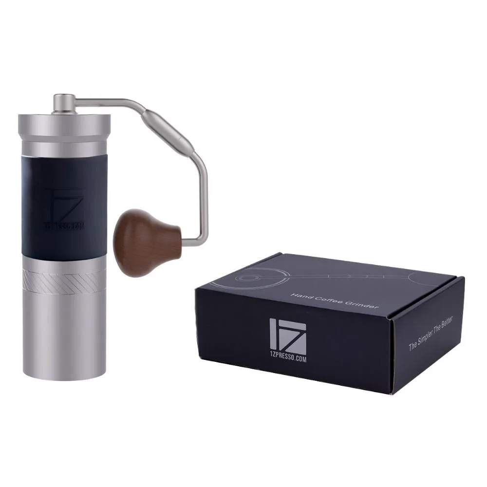 Silver manual coffee grinder with wooden handle beside black 1Zpresso retail box