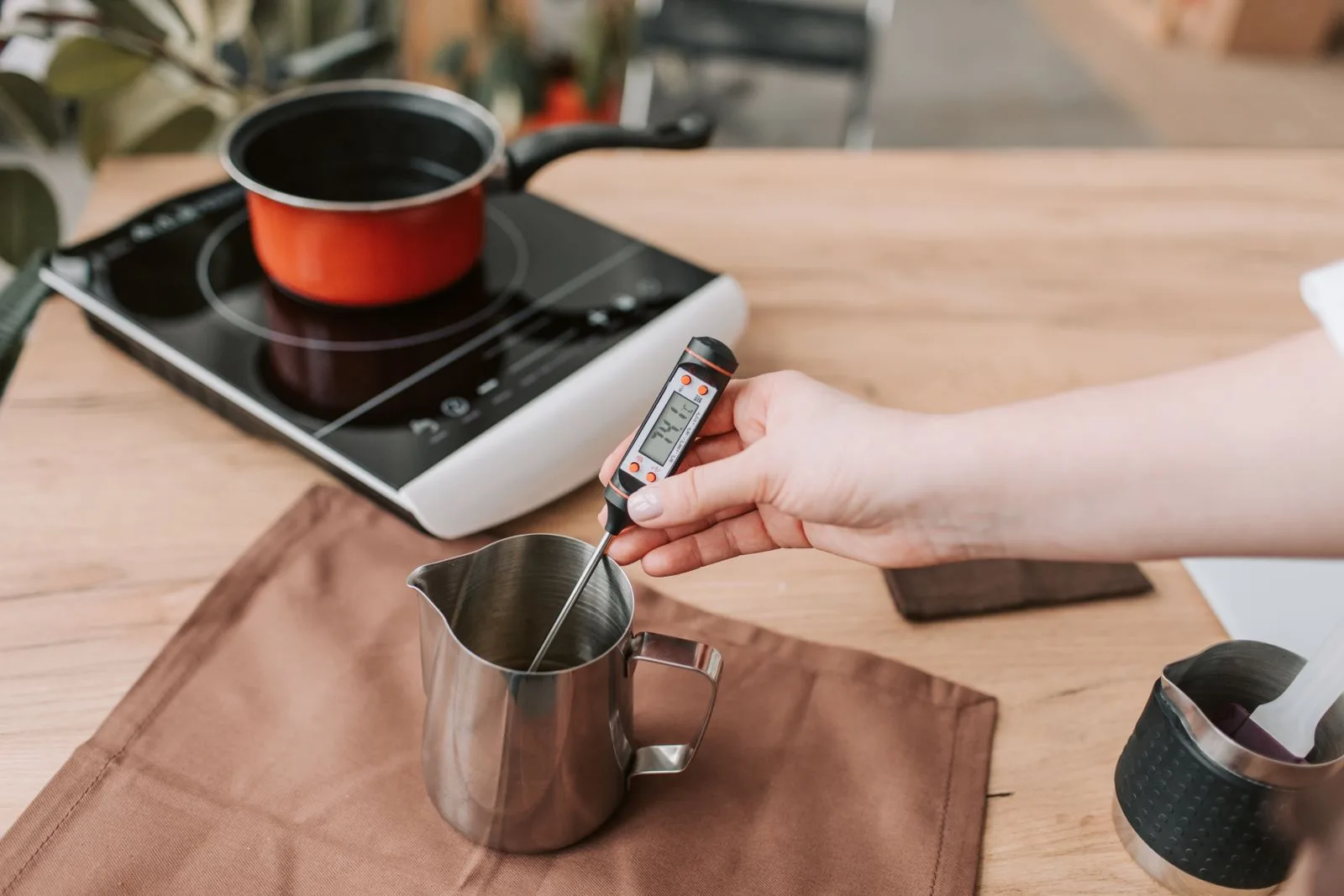 Digital instant-read thermometer displaying water temperature reading