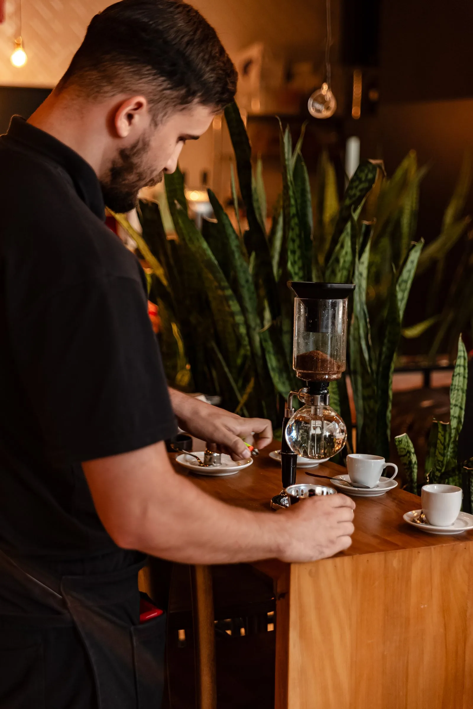 Coffee being prepared by hand in a specialty cafe with attention to detail