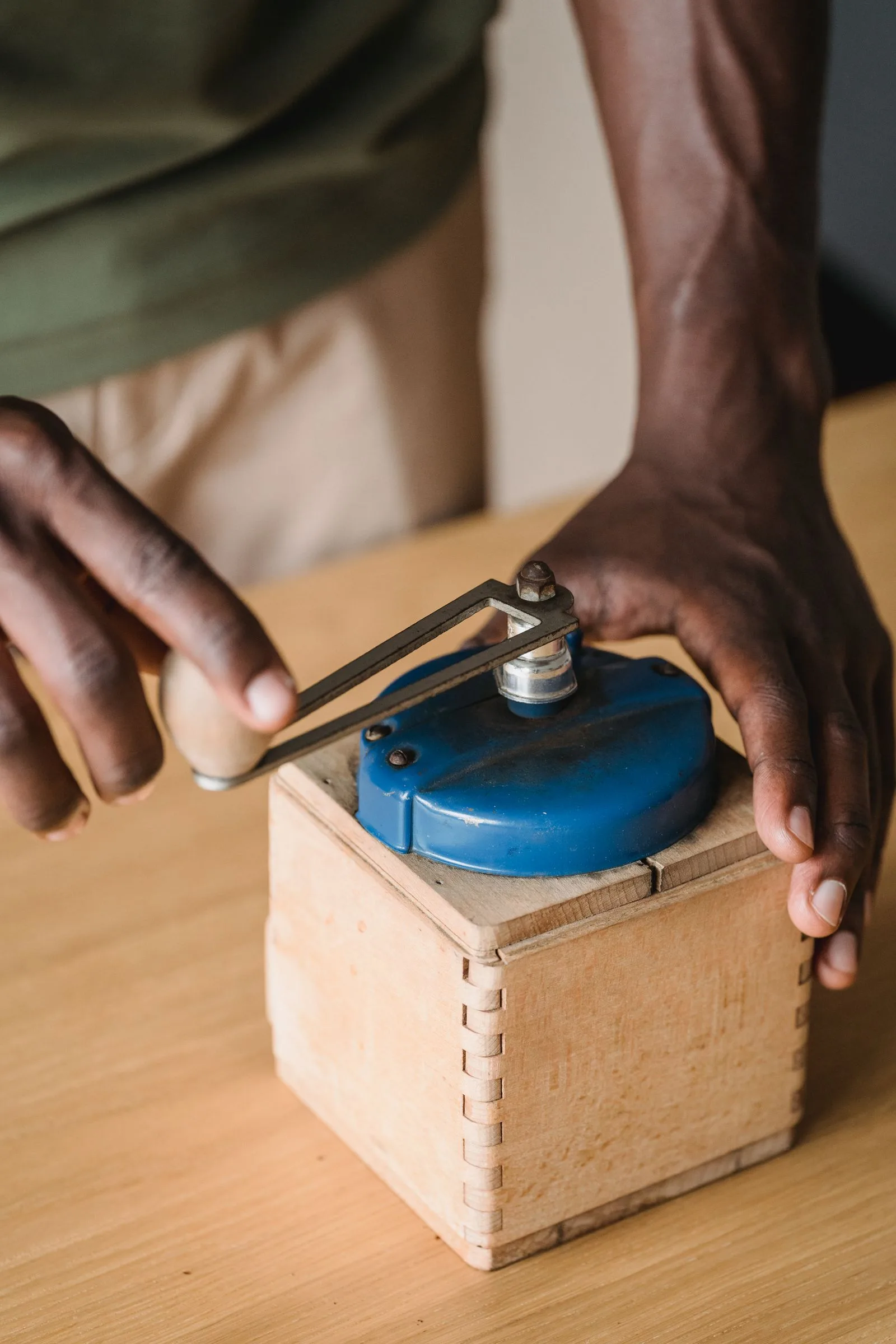 Coffee grinder showing progression from coarse to fine grind sizes