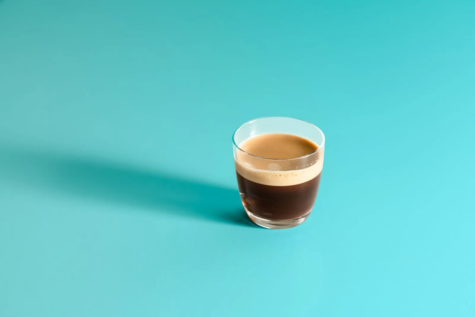 Multiple espresso cups showing different brew strengths and darkness from varied preparations