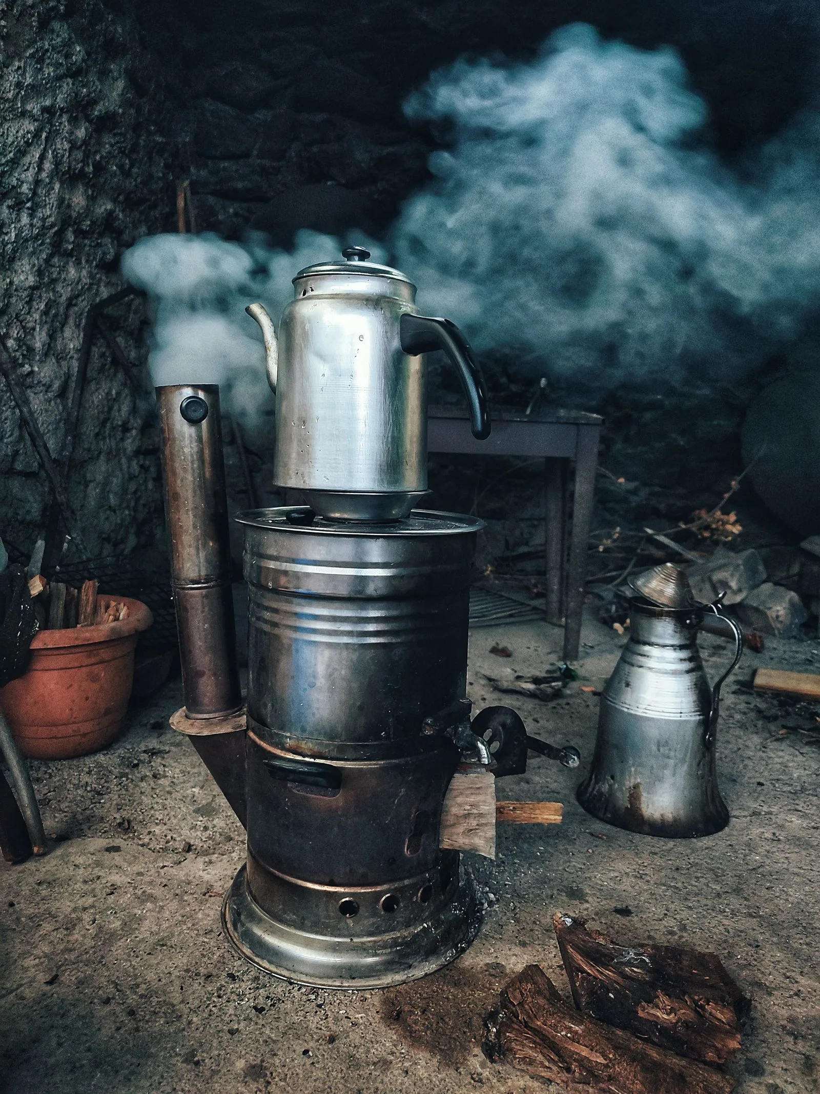 Steam rising from a vintage stovetop coffee percolator brewing